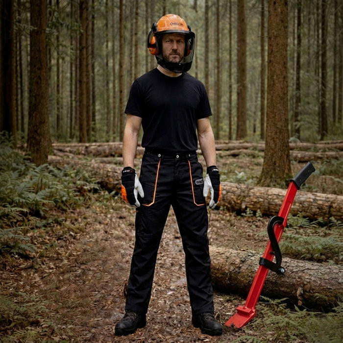 Man with felling lever wearing Oregon safety gear including chainsaw trousers, boots, helmet & gloves.