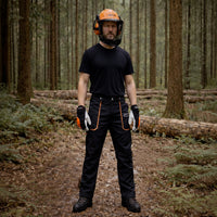 Man wearing Oregon safety gear including chainsaw trousers, boots, helmet & gloves.