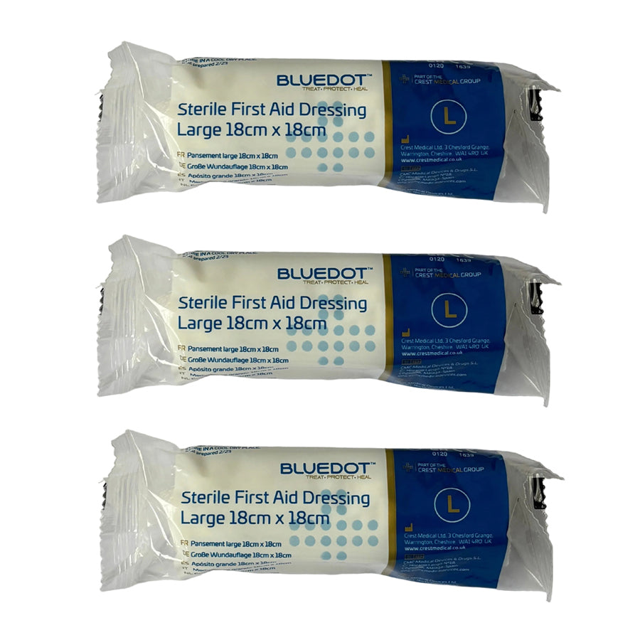 Three packages of Blue Dot sterile first aid dressings on a white background